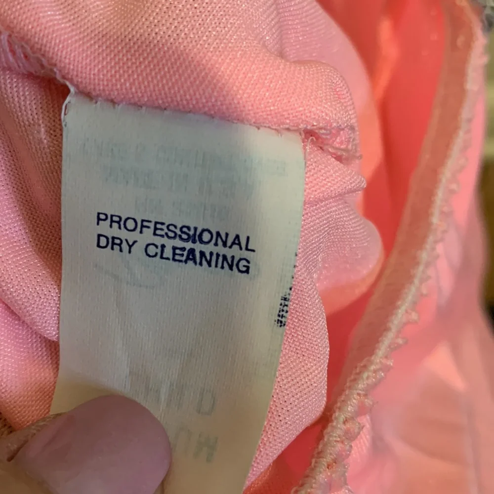Dansco pink leotard with halter tie and trimmed in silver sequins